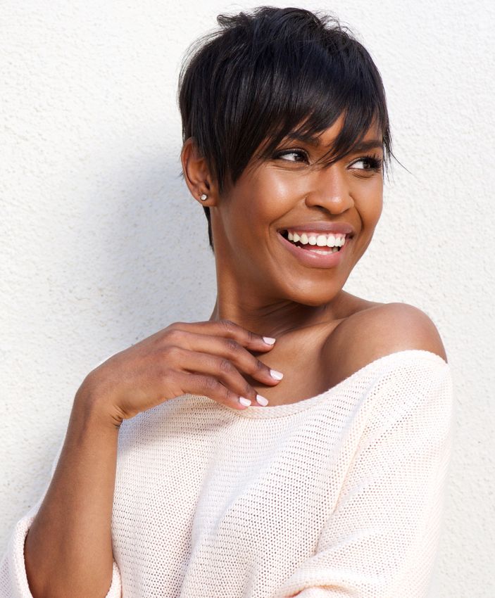 Newton Rosacea Treatment model with short hair and light sweater.