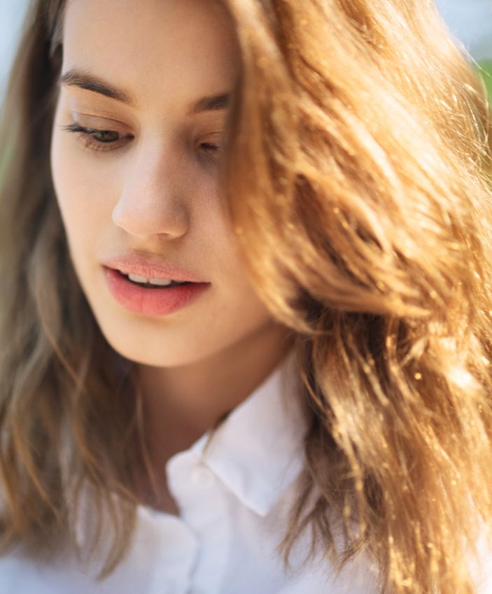 Newton Facials model with brown hair