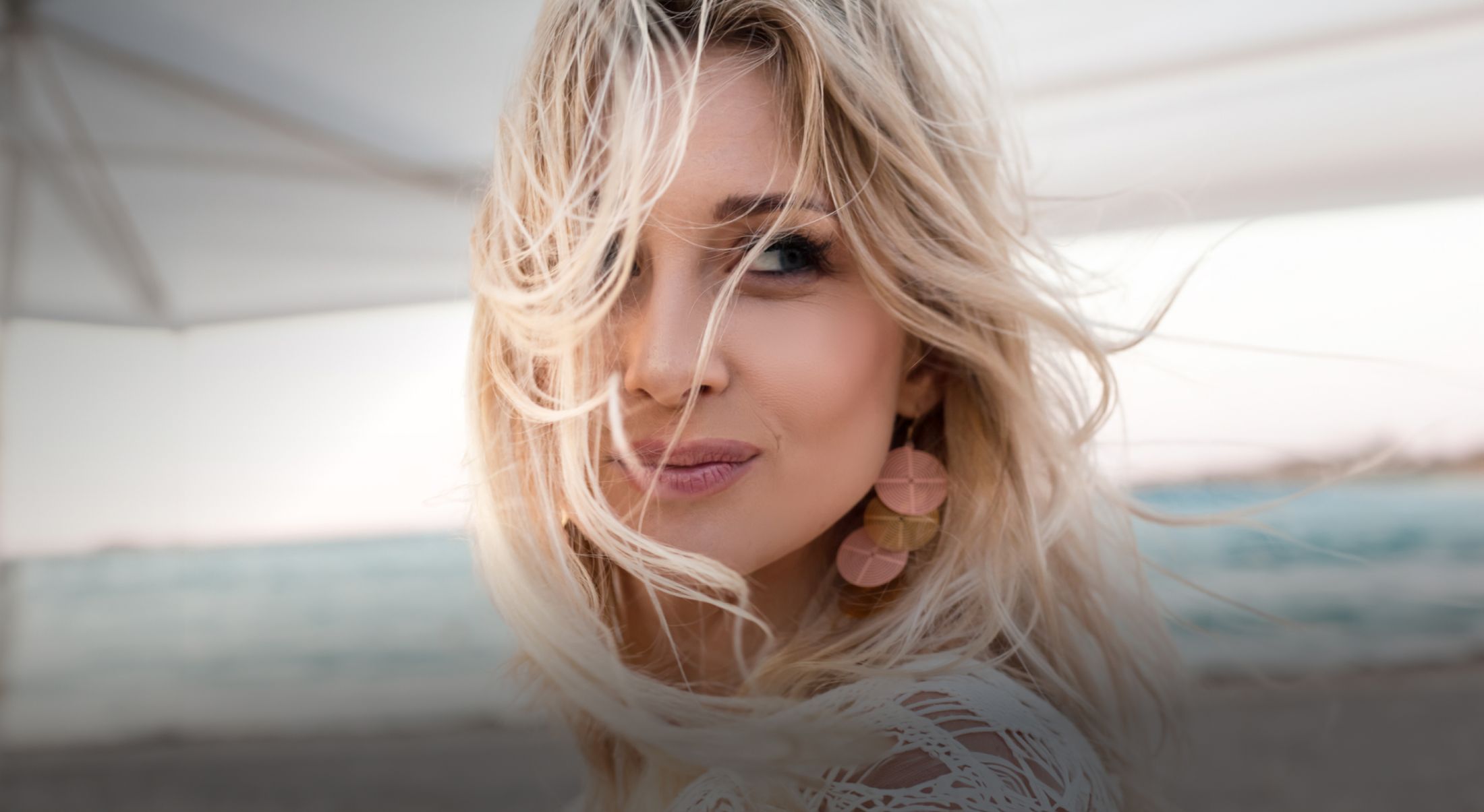 blonde woman with wind-blown hair